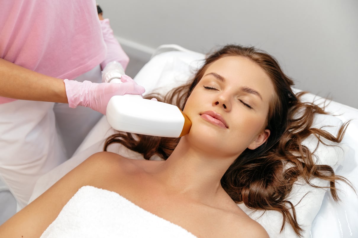 Aesthetic cosmetology. Laser hair removal. Removing unwanted hair from a girl's face using laser hair removal in a beauty salon. Facial skin care, depilation